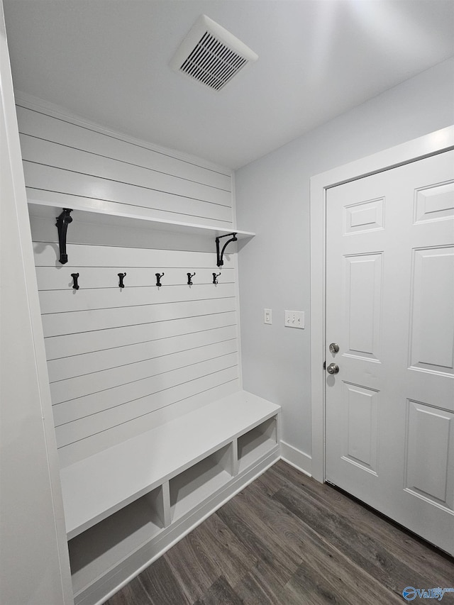 mudroom with visible vents and dark wood finished floors