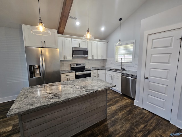 kitchen featuring visible vents, vaulted ceiling with beams, dark wood-style flooring, a sink, and stainless steel appliances