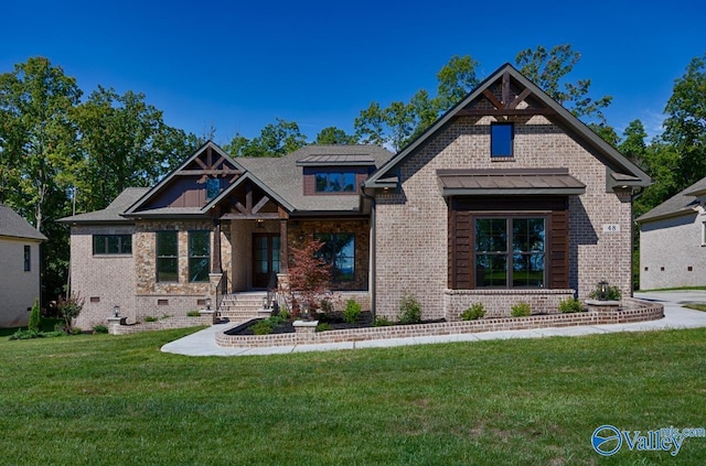 craftsman-style house featuring a front lawn