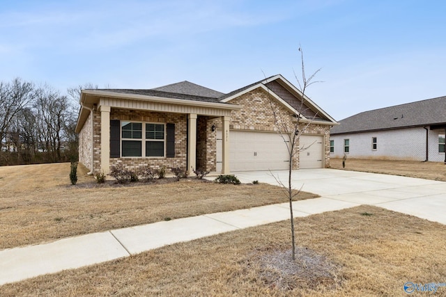 view of front of home featuring a garage and a front lawn