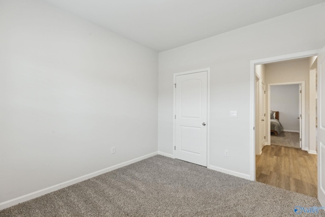 unfurnished bedroom with carpet