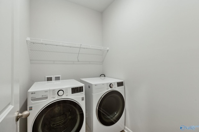 laundry room featuring washing machine and dryer