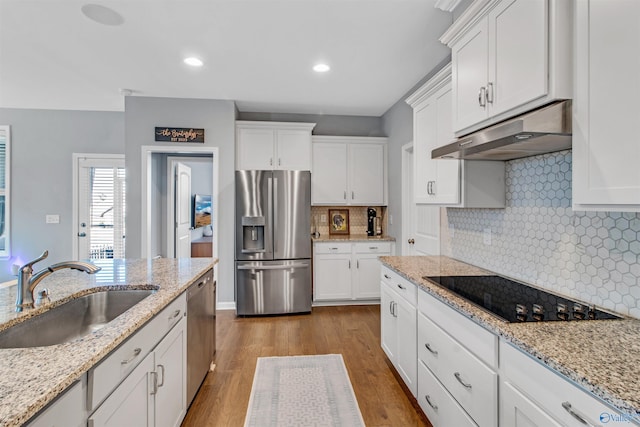 kitchen featuring a sink, white cabinets, appliances with stainless steel finishes, and under cabinet range hood
