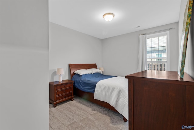 bedroom with light carpet