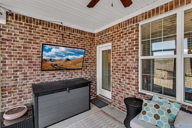 view of patio featuring ceiling fan