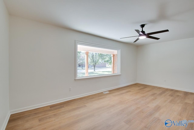 unfurnished room with light hardwood / wood-style floors and ceiling fan