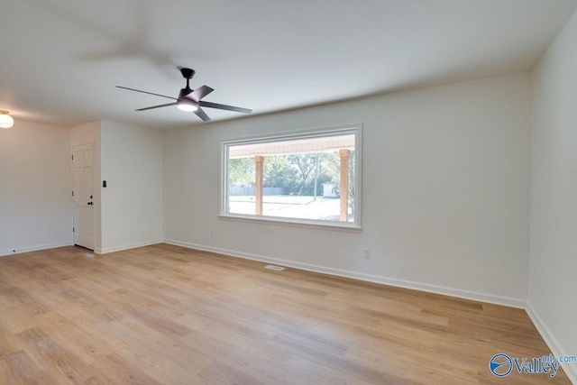 unfurnished room featuring ceiling fan and light hardwood / wood-style flooring