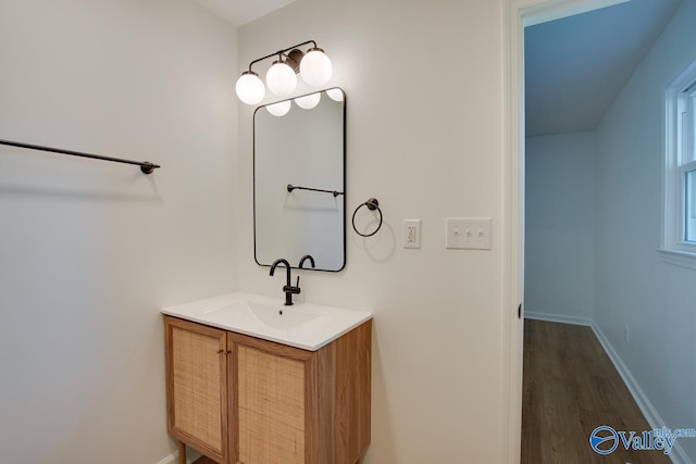 bathroom with vanity and hardwood / wood-style floors