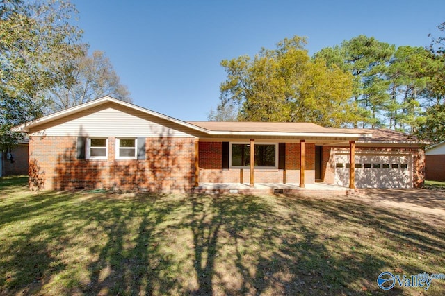 ranch-style house featuring a garage and a front lawn