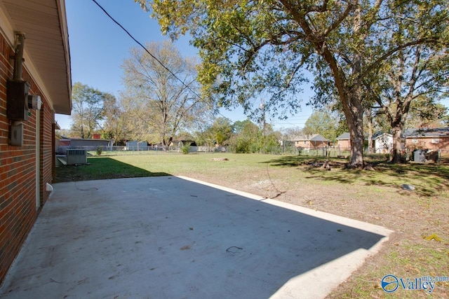 view of yard featuring a patio area and central air condition unit