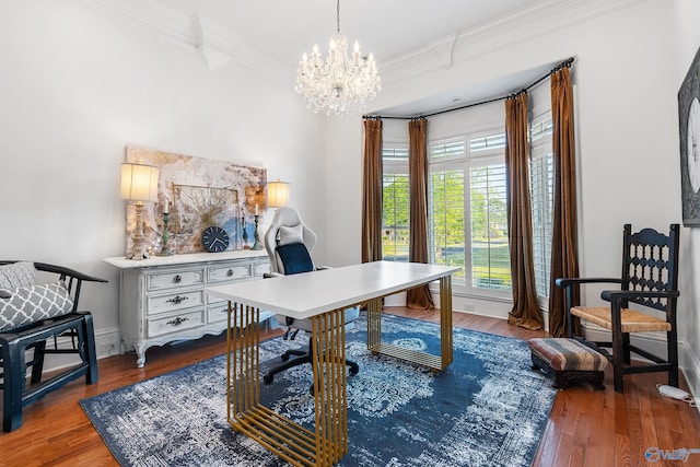 office space with a chandelier, wood finished floors, ornamental molding, and baseboards