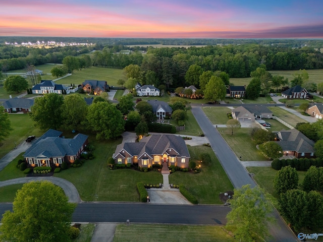 aerial view of property and surrounding area featuring nearby suburban area