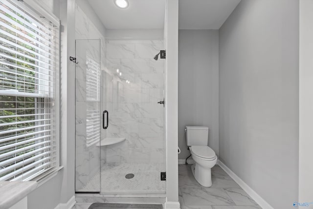 full bath with baseboards, marble finish floor, a marble finish shower, and toilet