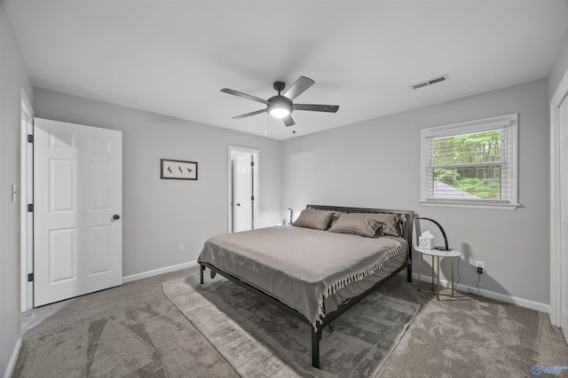 bedroom with baseboards, ceiling fan, carpet flooring, and visible vents