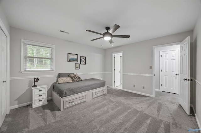 bedroom with ceiling fan, visible vents, baseboards, and carpet