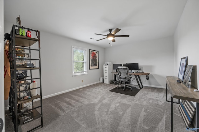 office featuring baseboards, a ceiling fan, carpet floors, and visible vents