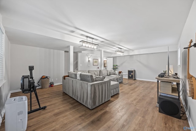 living room featuring baseboards and wood finished floors