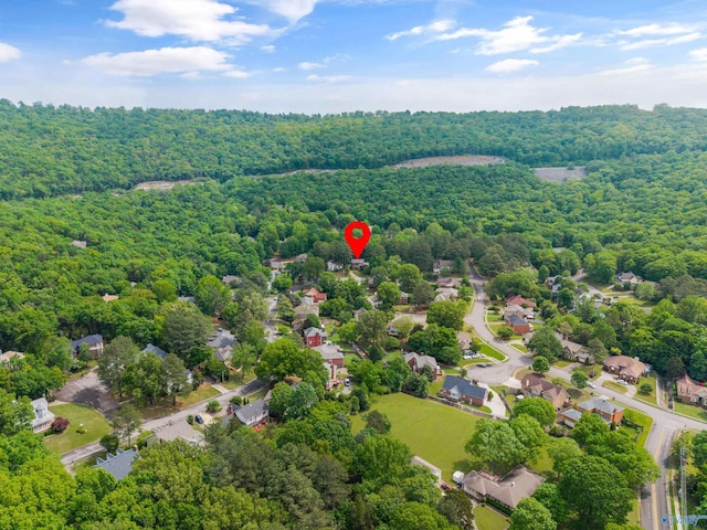 aerial view featuring a wooded view