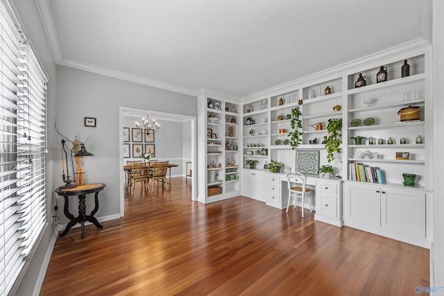 living area with an inviting chandelier, dark wood finished floors, and crown molding