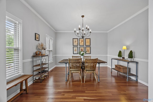 dining space featuring baseboards, a chandelier, a healthy amount of sunlight, and wood finished floors