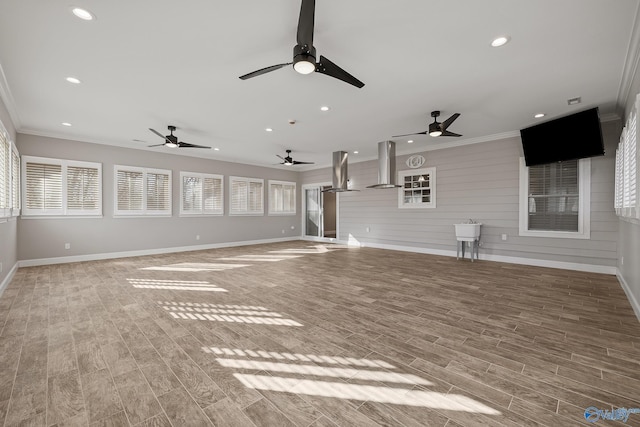 unfurnished living room featuring ornamental molding, ceiling fan, recessed lighting, and wood tiled floor