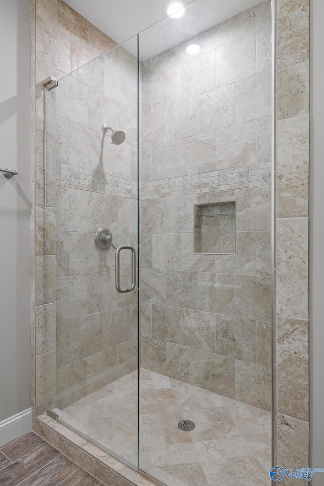 bathroom featuring a shower stall