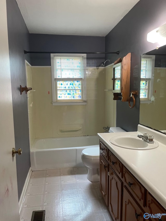 bathroom with tile patterned floors, visible vents, toilet, shower / washtub combination, and vanity