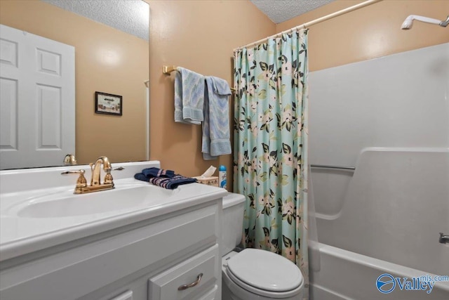 full bathroom featuring vanity, shower / tub combo, a textured ceiling, and toilet