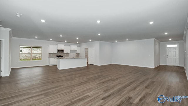 304 Wraywood Rd, Huntsville, AL 35810 - unfurnished living room with crown molding, baseboards, recessed lighting, and dark wood finished floors