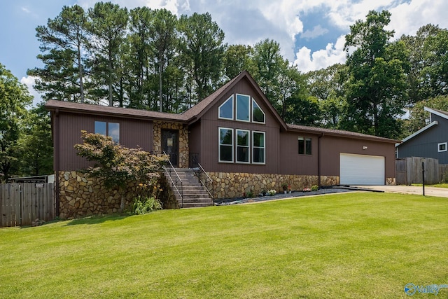 1104 Princeton Dr, Madison, AL 35758 - view of front of house featuring stone siding, asphalt driveway, a garage, and stairway