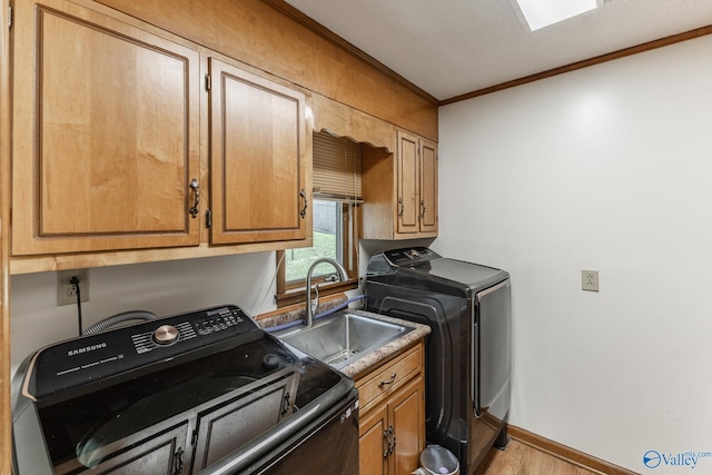 1104 Princeton Dr, Madison, AL 35758 - laundry room with cabinet space, ornamental molding, and wood finished floors