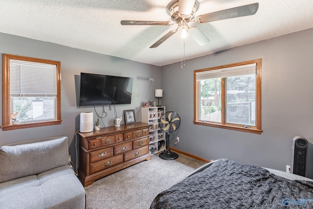 1104 Princeton Dr, Madison, AL 35758 - carpeted bedroom featuring a textured ceiling and a ceiling fan
