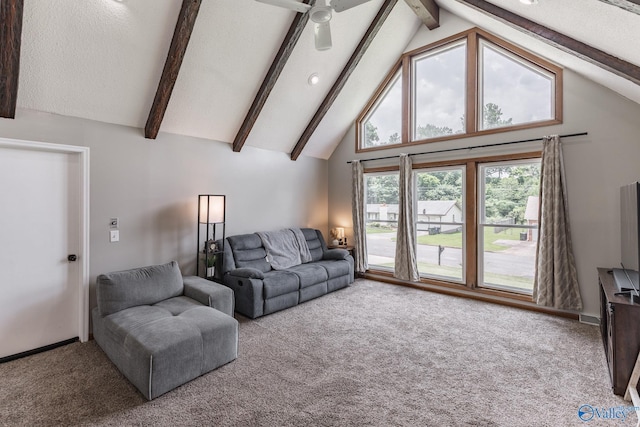 1104 Princeton Dr, Madison, AL 35758 - carpeted living area featuring beam ceiling, high vaulted ceiling, and a ceiling fan
