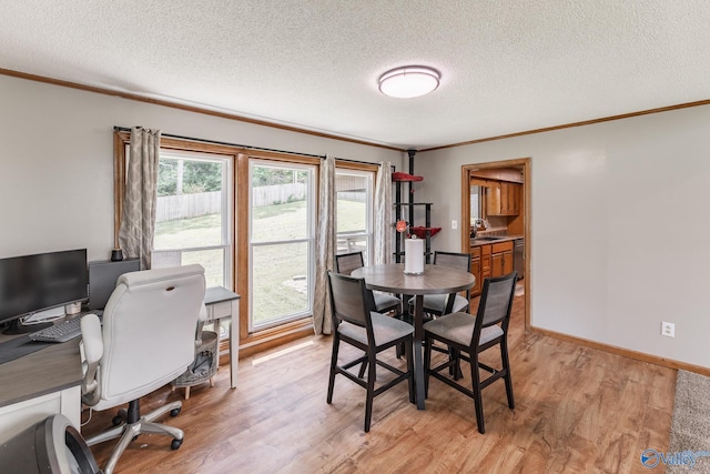 1104 Princeton Dr, Madison, AL 35758 - dining area featuring ornamental molding, light wood-style floors, a textured ceiling, and an office area