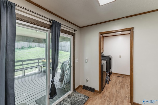 1104 Princeton Dr, Madison, AL 35758 - entryway with crown molding, light wood-style floors, plenty of natural light, and a wood stove