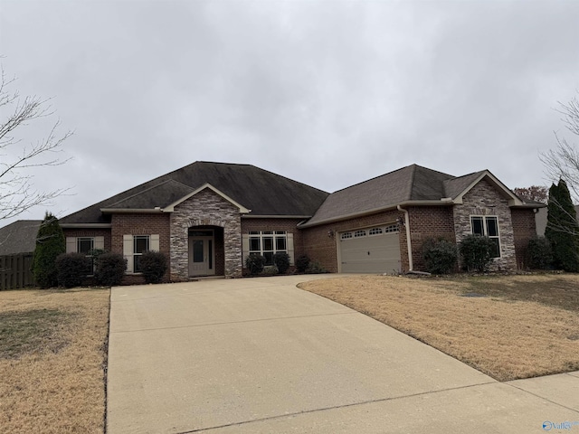 view of front of home with a front yard and a garage