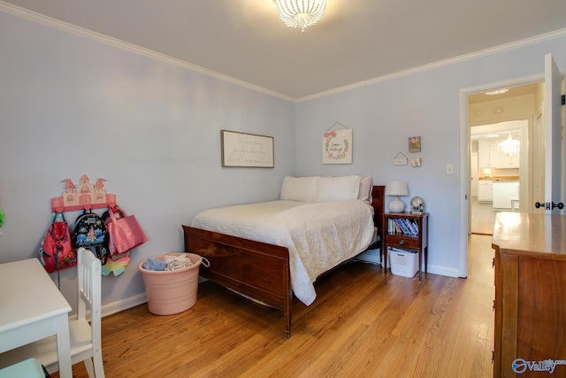 bedroom featuring crown molding and light hardwood / wood-style floors