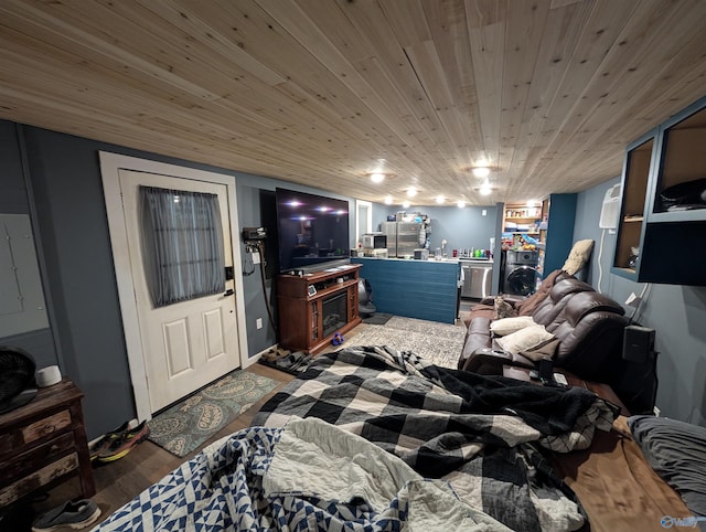 living area with wood ceiling and wood finished floors