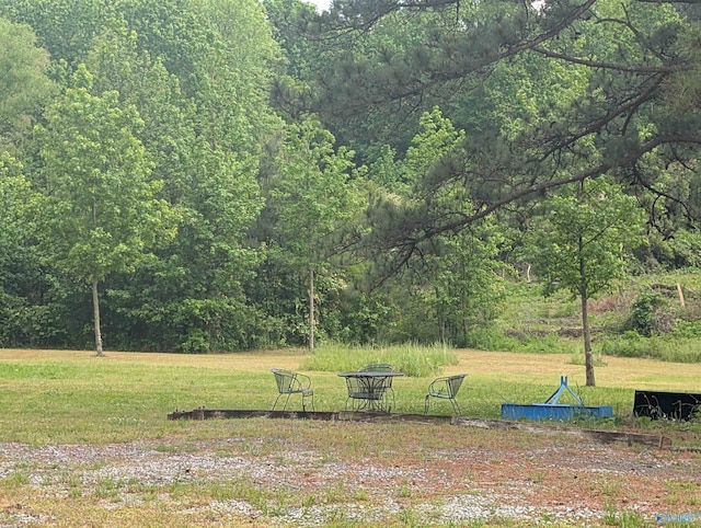 view of yard with a forest view