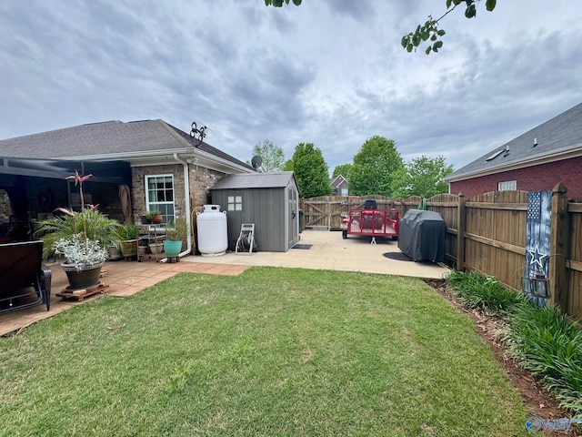 view of yard with a fenced backyard, an outdoor structure, a storage shed, and a patio