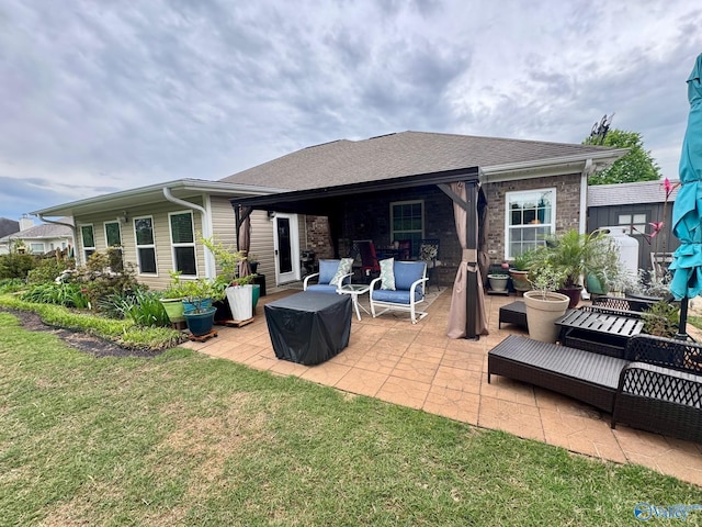 back of house with an outdoor living space, a patio area, a lawn, and roof with shingles