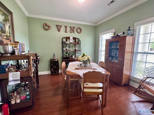 dining space with visible vents, crown molding, and dark wood-style floors