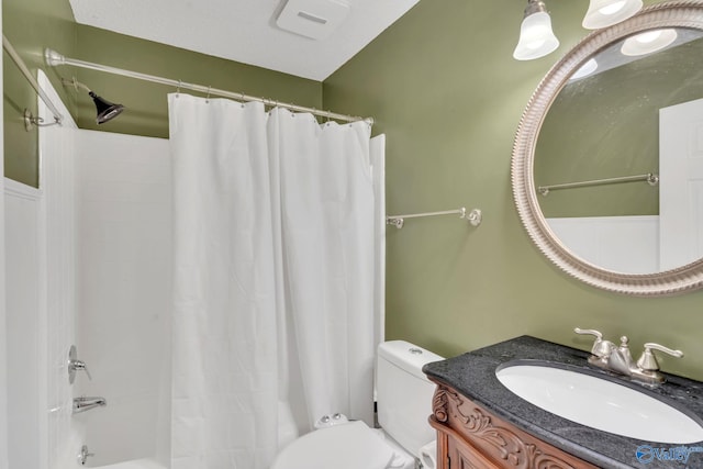 full bathroom featuring vanity, shower / bath combination with curtain, and toilet