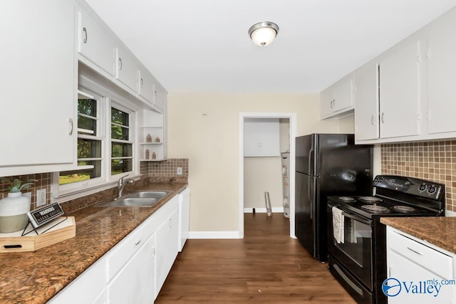 kitchen with decorative backsplash, black appliances, baseboards, and a sink