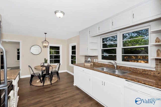 kitchen featuring tasteful backsplash, open shelves, dishwasher, dark wood-style floors, and a sink