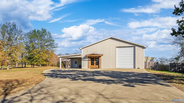 view of outdoor structure featuring a garage and a carport