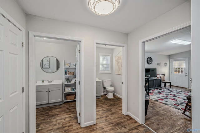 bathroom featuring hardwood / wood-style floors, vanity, toilet, and plenty of natural light