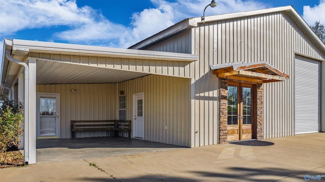 exterior space featuring a carport and french doors