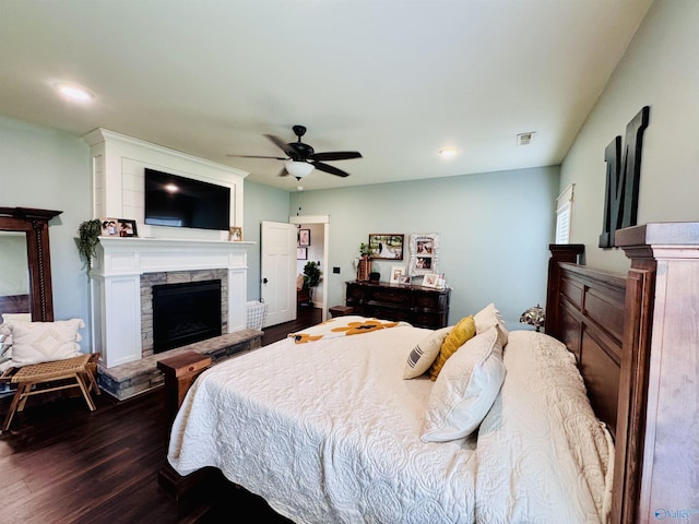 624 2nd Ave S, Loretto, TN 38469 - bedroom with dark wood finished floors, a stone fireplace, ceiling fan, and recessed lighting