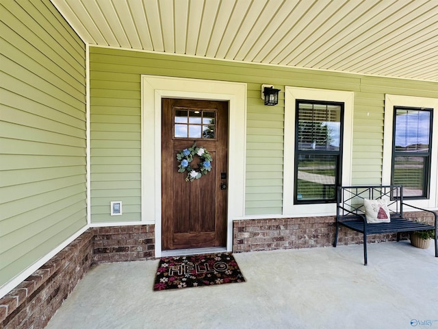 624 2nd Ave S, Loretto, TN 38469 - property entrance with covered porch and brick siding